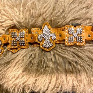 Rhinestone bling fleur-de-lis bell on tan leather. Size medium